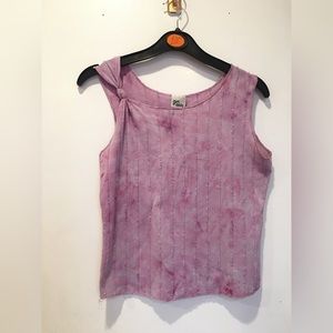 Light purple sleeveless top.